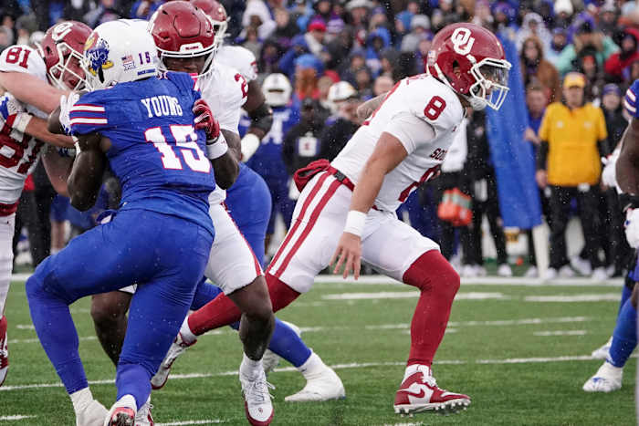 Oklahoma Sooners quarterback Dillon Gabriel runs against the Kansas Jayhawks.